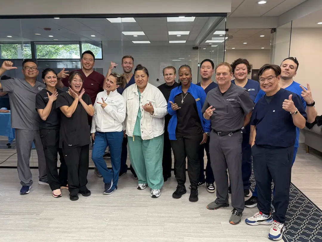 Dr. TJ Ahn guiding surgeons at a small-group cadaver lab